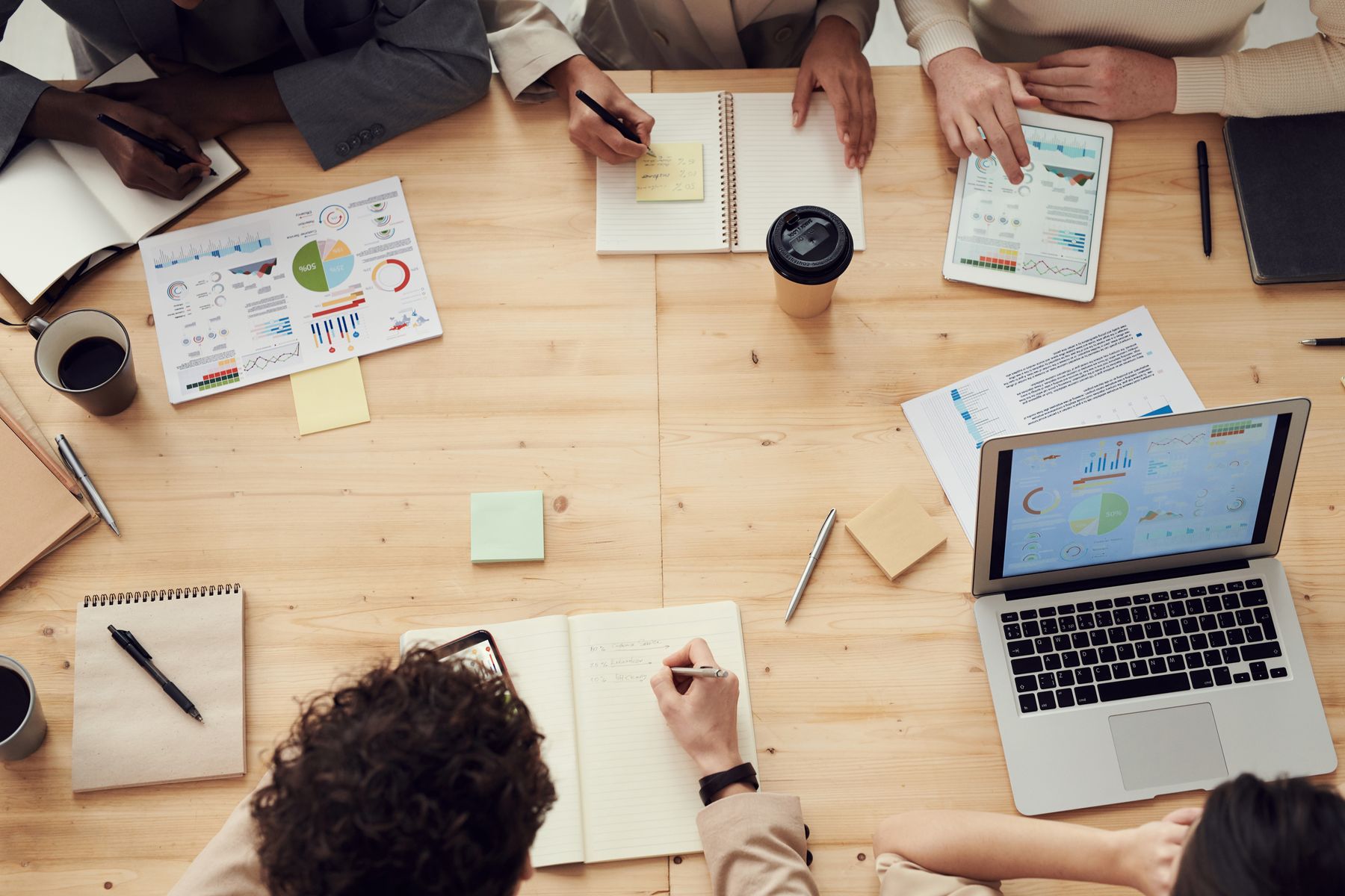 Business team reviewing data and strategy on a meeting table